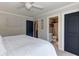 Bright bedroom featuring soft carpet, neutral walls, and access to the en-suite bath, offering a tranquil space at 304 Gilmer Ct, Canton, GA 30115