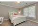 Bright bedroom with a soft color scheme, natural light, and comfortable furnishings, creating a peaceful haven at 304 Gilmer Ct, Canton, GA 30115