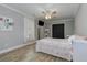 Bright and airy bedroom with a ceiling fan, neutral tones, and closet space providing a peaceful retreat at 304 Gilmer Ct, Canton, GA 30115