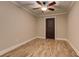 Comfortable bedroom with wood floors, neutral walls, and a ceiling fan, providing a blank canvas for personalization at 304 Gilmer Ct, Canton, GA 30115