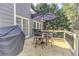 Outdoor deck with a table, seating, and a grill, perfect for entertaining and relaxation at 304 Gilmer Ct, Canton, GA 30115