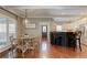 Open concept dining area and kitchen with stainless steel appliances and hardwood floors at 304 Gilmer Ct, Canton, GA 30115