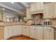 Elegant kitchen with granite counters, mosaic backsplash, gas cooktop, and stainless steel appliances at 304 Gilmer Ct, Canton, GA 30115
