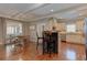 Bright eat-in kitchen boasts hardwood floors, a dining table set, and stainless steel appliances at 304 Gilmer Ct, Canton, GA 30115