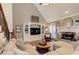 Comfortable living room with hardwood floors, fireplace, built-ins, and staircase at 304 Gilmer Ct, Canton, GA 30115