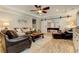Living room with leather seating and a view into another room with a pool table at 304 Gilmer Ct, Canton, GA 30115