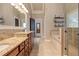 Lavish main bathroom with double vanity, soaking tub, and glass-enclosed shower at 304 Gilmer Ct, Canton, GA 30115