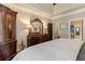 Spacious main bedroom showcasing elegant decor and a glimpse into the ensuite bathroom at 304 Gilmer Ct, Canton, GA 30115
