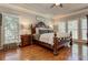 Elegant main bedroom with hardwood floors, decorative ceiling and bright windows at 304 Gilmer Ct, Canton, GA 30115