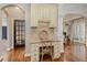 Dedicated office area featuring granite counters, mosaic backsplash and cream colored cabinetry at 304 Gilmer Ct, Canton, GA 30115