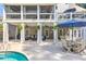 A covered outdoor patio is set up with a table, chairs, and seating at 304 Gilmer Ct, Canton, GA 30115
