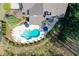 Aerial view of the large in-ground pool and patio area surrounded by mature landscaping at 304 Gilmer Ct, Canton, GA 30115