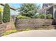 Stone retaining wall with stairs and landscaping at 304 Gilmer Ct, Canton, GA 30115