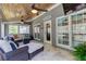 Inviting sunroom featuring a wood ceiling, tile floors, ceiling fans and lots of natural light at 304 Gilmer Ct, Canton, GA 30115
