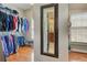 Spacious walk-in closet with ample storage, metal shelving, and wood flooring, perfect for organizing your wardrobe at 304 Gilmer Ct, Canton, GA 30115