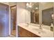The dual-sink bathroom features updated fixtures, warm earthy tones, and a convenient shower at 898 Oak Sw St # 1101, Atlanta, GA 30310