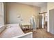 A charming bedroom with a twin bed, vanity area, and neutral walls provides a serene and stylish retreat at 898 Oak Sw St # 1101, Atlanta, GA 30310