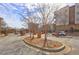 Gated community entrance with brick columns and mature trees on a sunny day, ensuring secure and scenic access for residents at 898 Oak Sw St # 1101, Atlanta, GA 30310