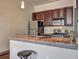 Kitchen with stainless steel appliances and granite countertops with barstool seating at 898 Oak Sw St # 1101, Atlanta, GA 30310