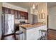 This kitchen features stainless steel appliances and a granite countertop with barstool seating at 898 Oak Sw St # 1101, Atlanta, GA 30310