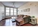 Inviting living room with hardwood floors, large windows, and an open floorplan at 898 Oak Sw St # 1101, Atlanta, GA 30310