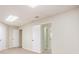 Unfinished basement space featuring carpeted floors, neutral paint, and multiple doors and closets at 1235 Saint Ives Ct, Suwanee, GA 30024