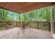 Spacious wooden deck surrounded by lush greenery, perfect for outdoor entertaining at 1235 Saint Ives Ct, Suwanee, GA 30024