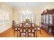 Formal dining room with wood floors, chandelier, and classic furnishings at 1235 Saint Ives Ct, Suwanee, GA 30024