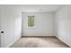A large empty bedroom with a big window overlooking the backyard at 2814 Cobb Place Manor Ct, Marietta, GA 30066