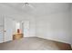 A spacious bedroom with carpet flooring, white walls, and a ceiling fan at 2814 Cobb Place Manor Ct, Marietta, GA 30066