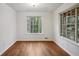 Bedroom featuring wood floor and a window offering natural light at 2814 Cobb Place Manor Ct, Marietta, GA 30066