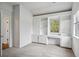 A bedroom with built-in shelves, drawers, and a window for natural light at 2814 Cobb Place Manor Ct, Marietta, GA 30066