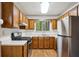 Kitchen with stainless steel appliances and wooden cabinets at 2814 Cobb Place Manor Ct, Marietta, GA 30066