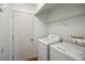 Laundry room with washer, dryer, and wire shelving at 2814 Cobb Place Manor Ct, Marietta, GA 30066