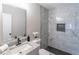 Bathroom showcasing a modern vanity, shower, and tiled walls at 3814 Whaley Ct, Snellville, GA 30039