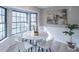 Cozy dining area with modern lighting and natural light from large windows at 3814 Whaley Ct, Snellville, GA 30039