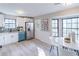 Modern kitchen with stainless steel appliances, white cabinets, and stylish breakfast nook at 3814 Whaley Ct, Snellville, GA 30039
