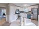 Modern kitchen with stainless steel appliances, white cabinets, and stylish breakfast nook at 3814 Whaley Ct, Snellville, GA 30039