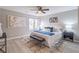 Inviting main bedroom with large windows, fan, and decorative accents at 3814 Whaley Ct, Snellville, GA 30039