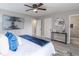 Serene main bedroom featuring soft lighting, fan, a well-dressed bed and ensuite bathroom at 3814 Whaley Ct, Snellville, GA 30039