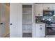 Spacious pantry with ample shelving located adjacent to kitchen with stainless appliances at 3814 Whaley Ct, Snellville, GA 30039