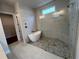 Contemporary bathroom featuring a freestanding tub, walk-in shower, and modern fixtures at 486 Broom Dr, Cumming, GA 30040