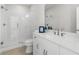Modern bathroom with a glass-enclosed shower, double vanity, and sleek fixtures at 486 Broom Dr, Cumming, GA 30040
