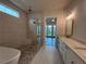 Elegant bathroom features a soaking tub, walk-in shower, and double vanity at 486 Broom Dr, Cumming, GA 30040