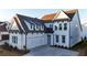 Beautiful two-story home with a two-car garage, large windows, white siding, and a well-maintained front yard at 486 Broom Dr, Cumming, GA 30040