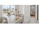 Bright hallway featuring neutral decor, plush carpeting, and a view to the second level at 486 Broom Dr, Cumming, GA 30040