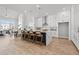 Spacious kitchen featuring a large island with seating, white cabinets, and modern appliances at 486 Broom Dr, Cumming, GA 30040