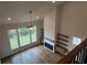 Elevated view of a living room featuring hardwood floors, a fireplace, and large windows at 486 Broom Dr, Cumming, GA 30040