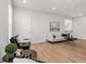 Open-concept living room features hardwood floors and lots of natural light at 486 Broom Dr, Cumming, GA 30040