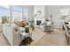 Inviting living room with large windows, fireplace, and stylish furniture for comfortable living at 486 Broom Dr, Cumming, GA 30040